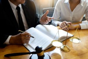 lawyer or judge gavel with balance work with client or customer about agreement