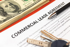 Commercial lease agreement form close-up. House keys